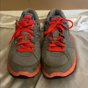 Grey Nike running shoes